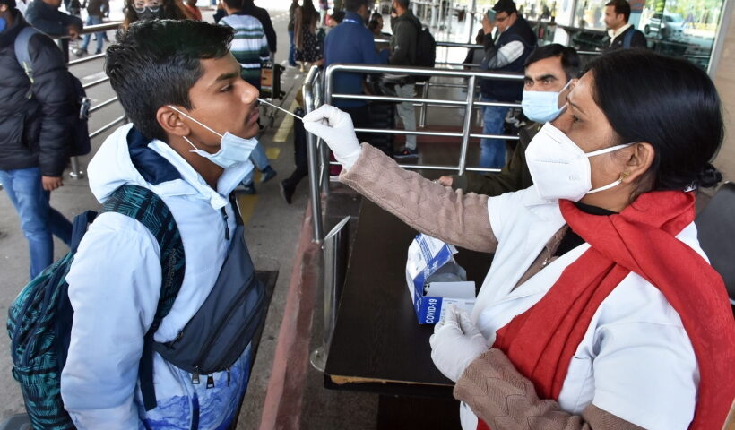 Ranchi: A health worker collects a nasal sample for Covid-19 test from a passenger at Birsa Munda International Airport in Ranchi