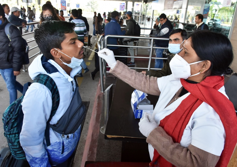 Ranchi: A health worker collects a nasal sample for Covid-19 test from a passenger at Birsa Munda International Airport in Ranchi
