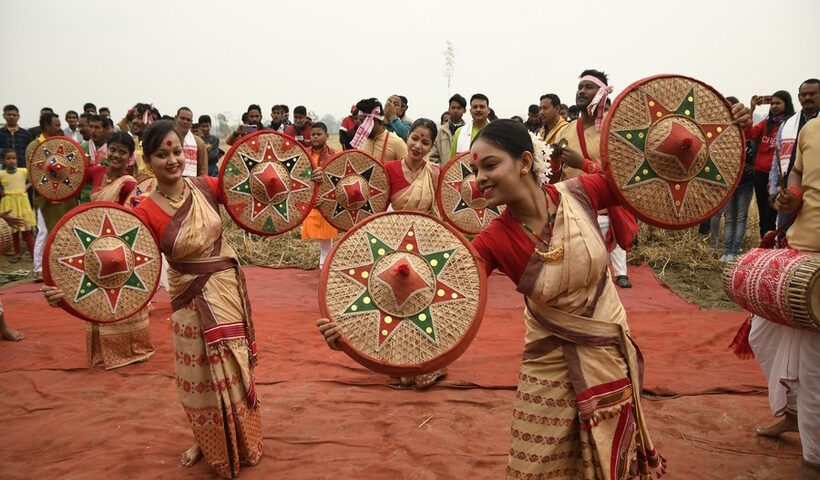 People perform Bihu, a folk dance during the Magh Bihu Festival in Nagaon district of India's northeastern state of Assam