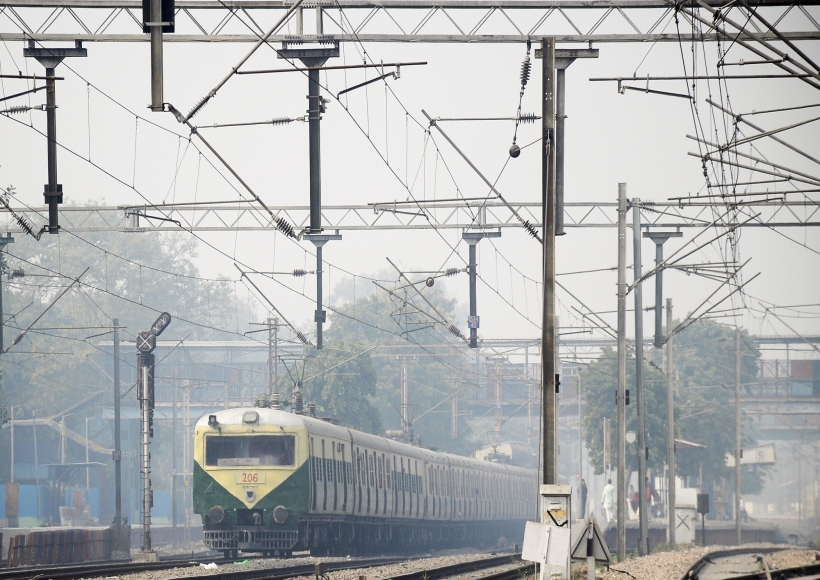 New Delhi: A train moves slowly on track amid dense fog during a cold morning, in New Delhi on Monday