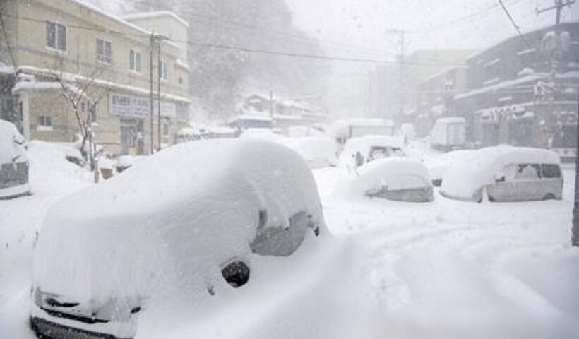 Cars parked on eastern Ulleung Island are covered in snow on Jan. 24, 2023, after heavy snowfall was reported in the area.