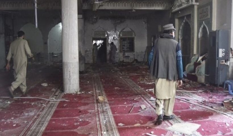 Rescuers inspect damaged area of a mosque following a blast in Peshawar, Pakistan, on March