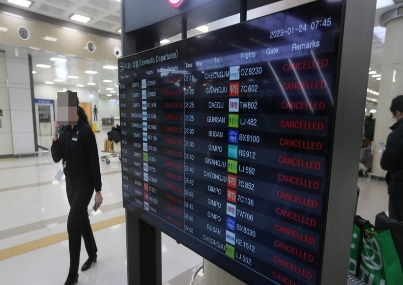 An electronic signboard at Jeju International Airport on the southern Jeju Island shows domestic flights cancelled