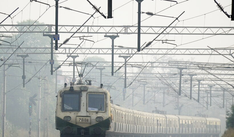 New Delhi: A train runs on a railway track slowly amid low visibility due to fog, in New Delhi