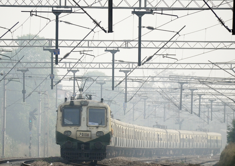 New Delhi: A train runs on a railway track slowly amid low visibility due to fog, in New Delhi