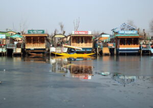 Srinagar: Shikaras seen on frozen Dal Lake as the temperature dips, in Srinagar