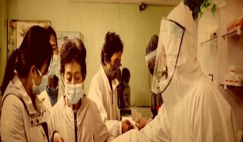 This image, captured from the Korean Central Television on Jan 24, 2023, shows a documentary film aired the previous day touting North Korea's measures against the COVID-19 pandemic.