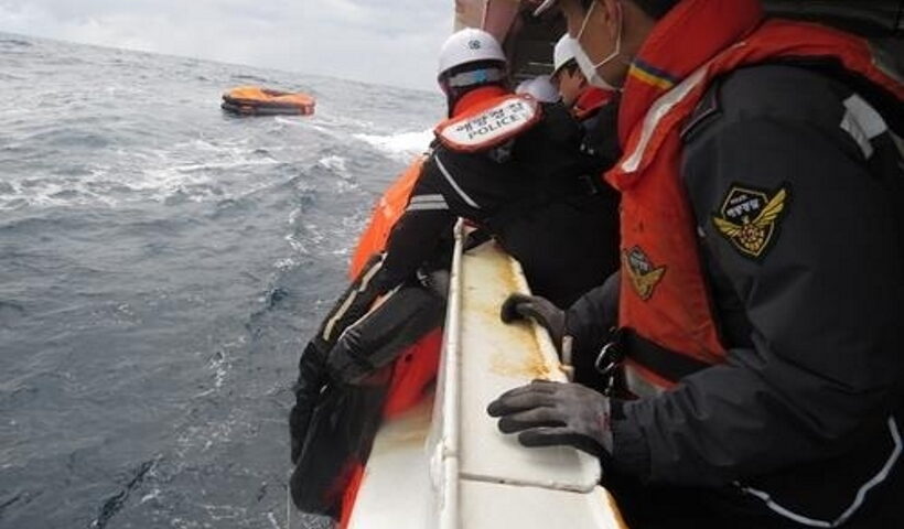 This image provided by the Korea Coast Guard shows a search operation under way after a cargo ship sank off the southern island of Jeju