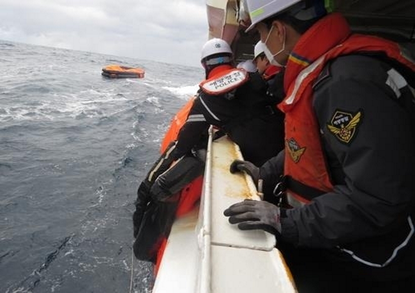 This image provided by the Korea Coast Guard shows a search operation under way after a cargo ship sank off the southern island of Jeju