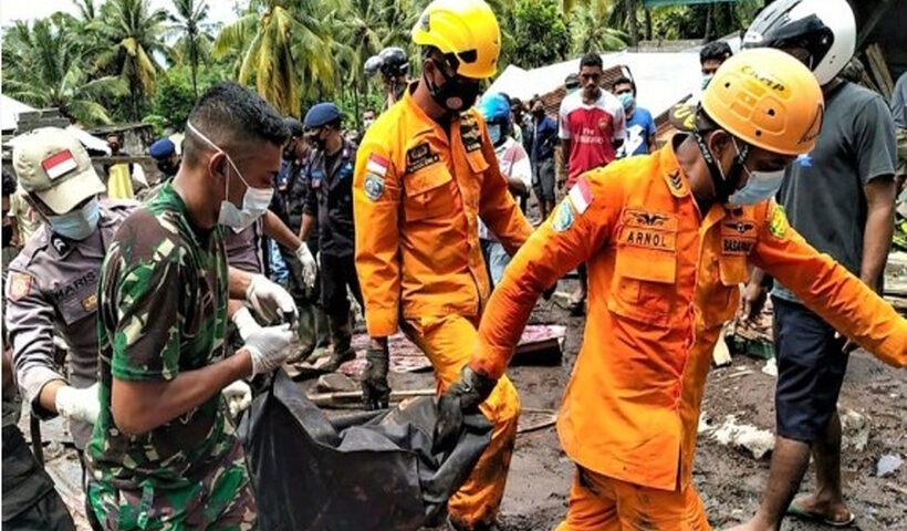 Members of Search and Rescue (SAR) team evacuate a victim of flash floods and landslides in Flores Timur district, East Nusa Tenggara, Indonesia.