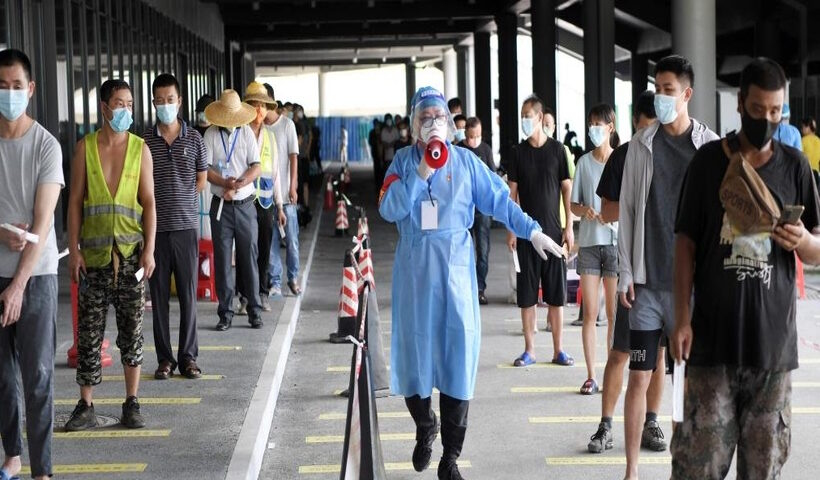A volunteer works at a nucleic acid testing site in Sanya, south China's Hainan Province, Aug. 7, 2022. (Xinhua/Zhao Yingquan/IANS)