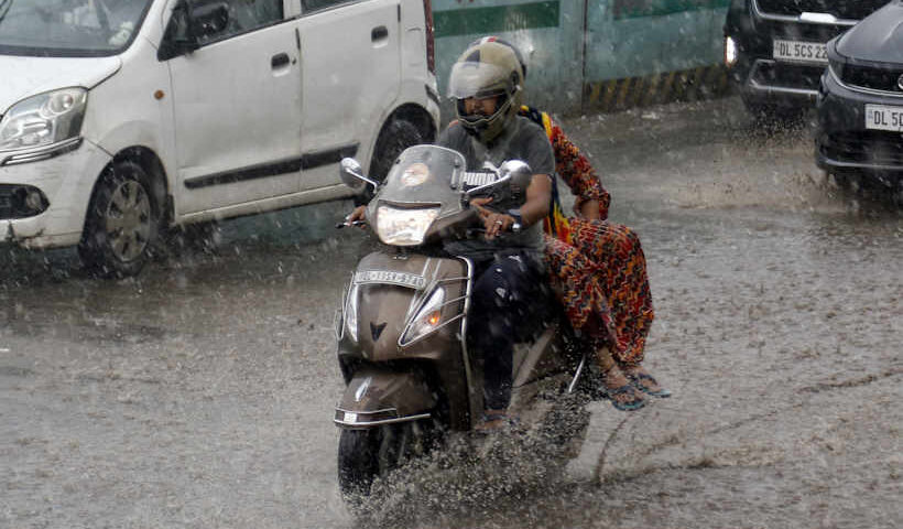 New Delhi: Vehicles ply on road during heavy monsoon rains