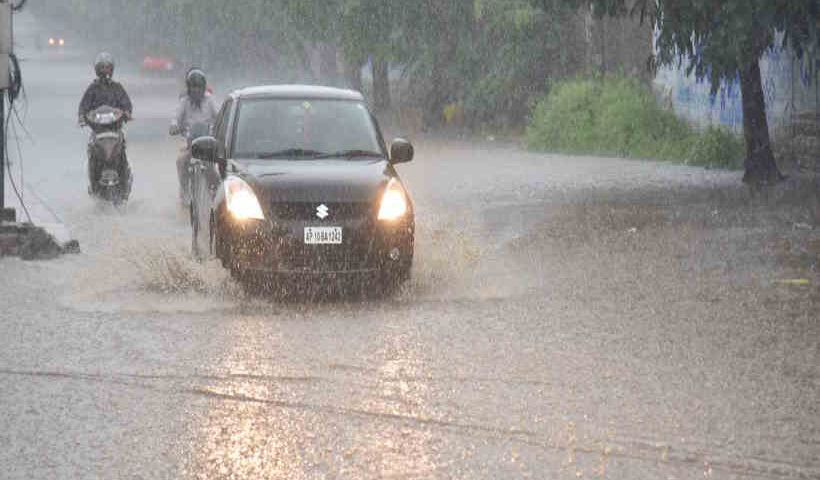 Hyderabad: Vehicles wade through a water-logged road during rains in Hyderabad