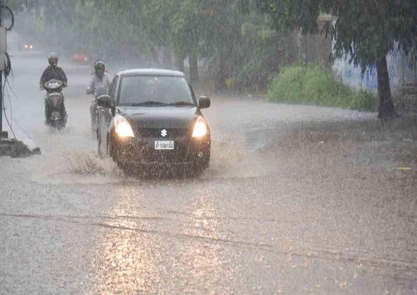 Hyderabad: Vehicles wade through a water-logged road during rains in Hyderabad