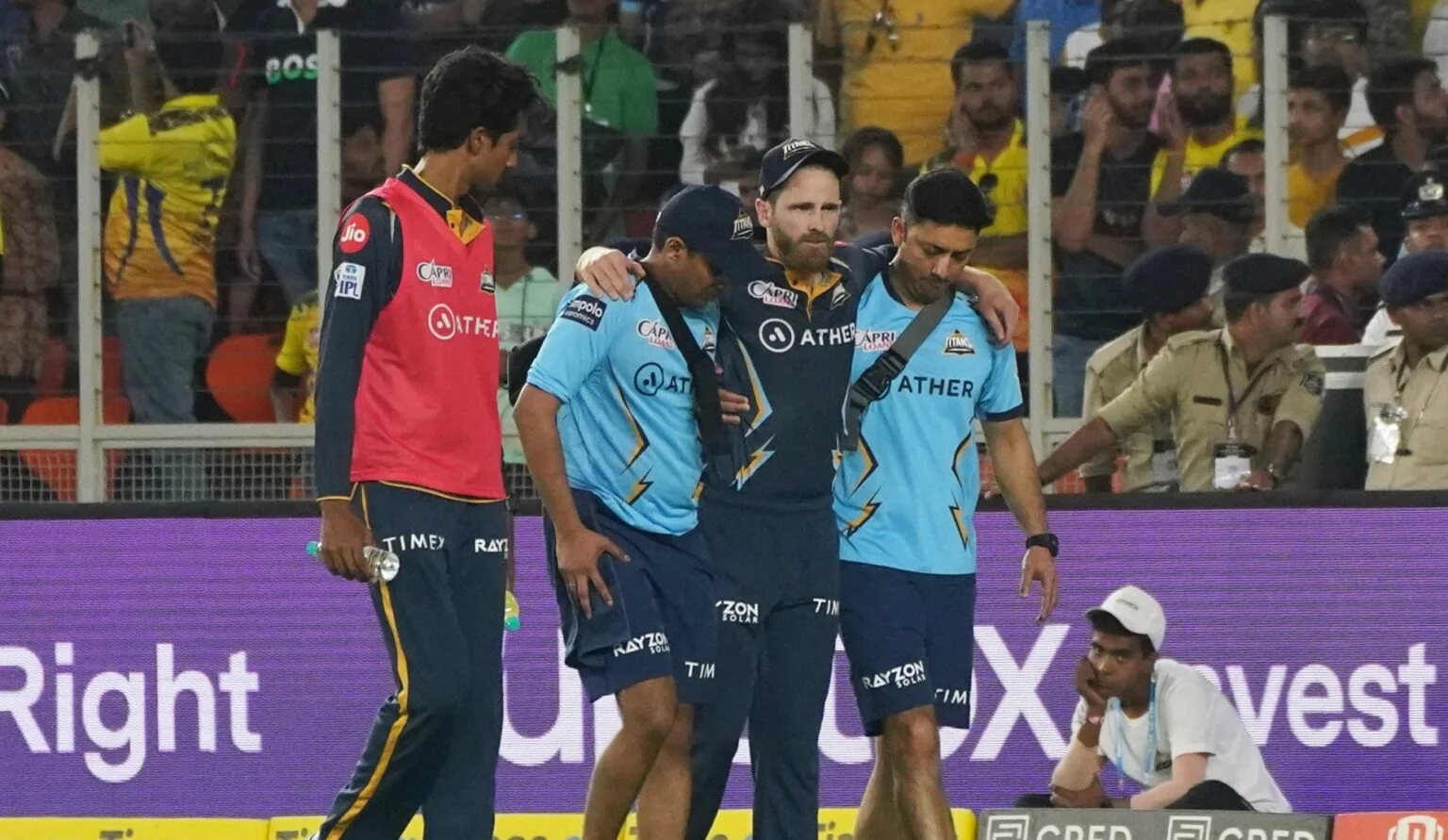 GT batter Kane Williamson leaves the ground after getting injured while fielding