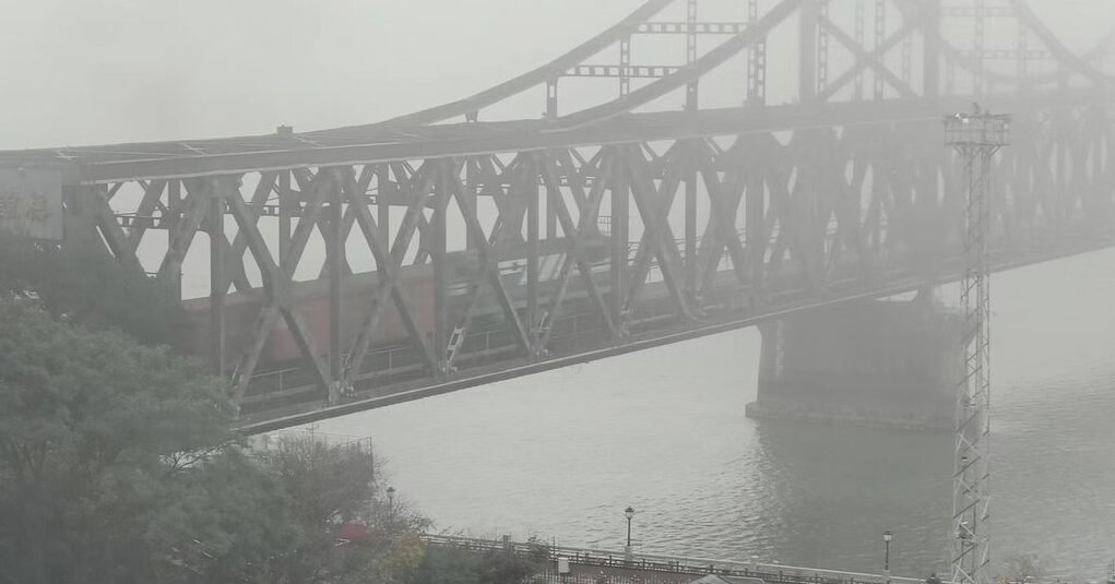 A freight train crosses the Sino-Korean Friendship Bridge