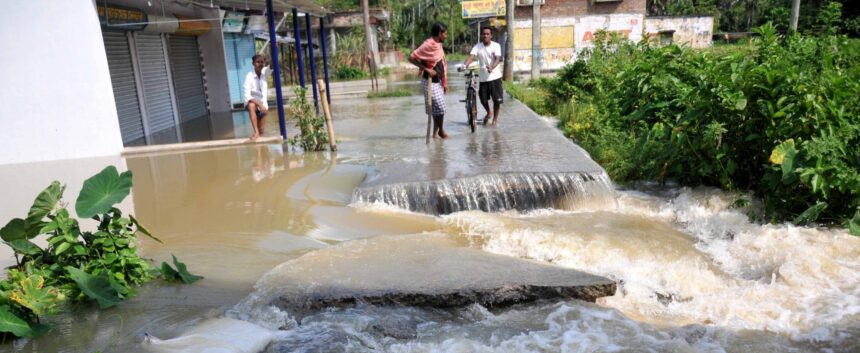 A portion of a road washed away flood affected area