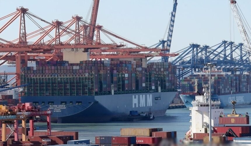 Container ships are loaded with export cargo at Busan New Port
