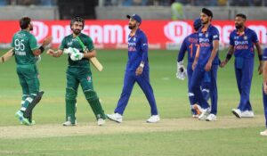 Pakistan batters Khushdil Shah,Iftikhar Ahmed, third right, are greeted by Indian players.