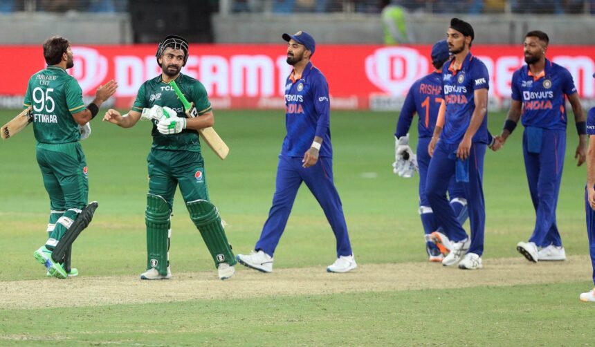 Pakistan batters Khushdil Shah,Iftikhar Ahmed, third right, are greeted by Indian players.