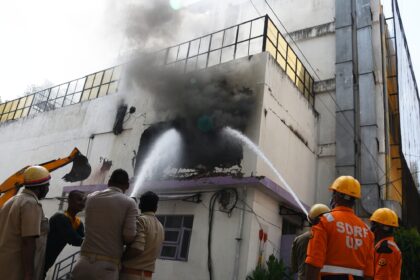 Firefighters attempt to douse fire after it broke out at Hotel Levana
