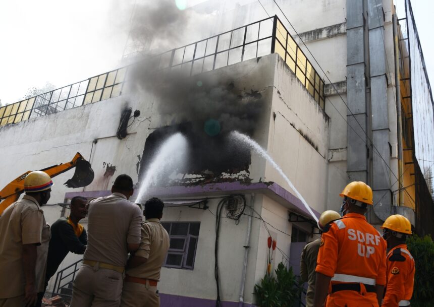 Firefighters attempt to douse fire after it broke out at Hotel Levana