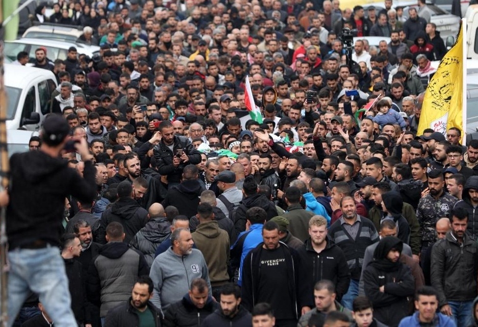 People attend a funeral of Palestinians