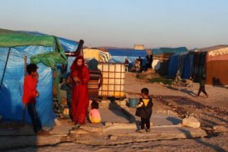 Refugees from Syria are seen at a temporary settlement in Hatay