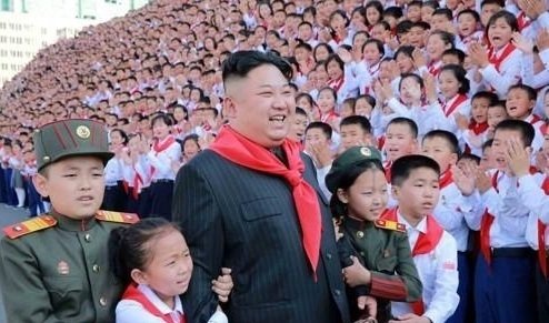 North Korea's leader Kim Jong-un posing for a photo with members of the Korean Children's Union at the organization's 8th congress that month