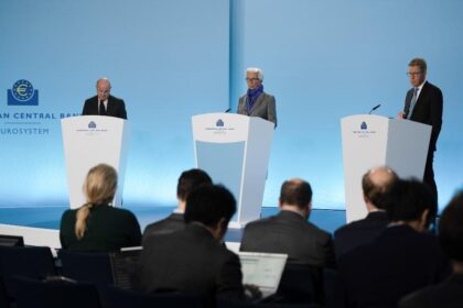 A President of the European Central Bank (ECB) Christine Lagarde (C) attends a press conference in Frankfurt