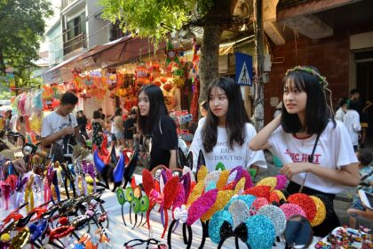 Girls shop at a market ahead of Mid-Autumn Festival