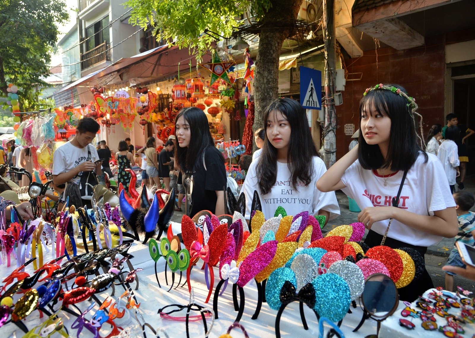 Girls shop at a market ahead of Mid-Autumn Festival