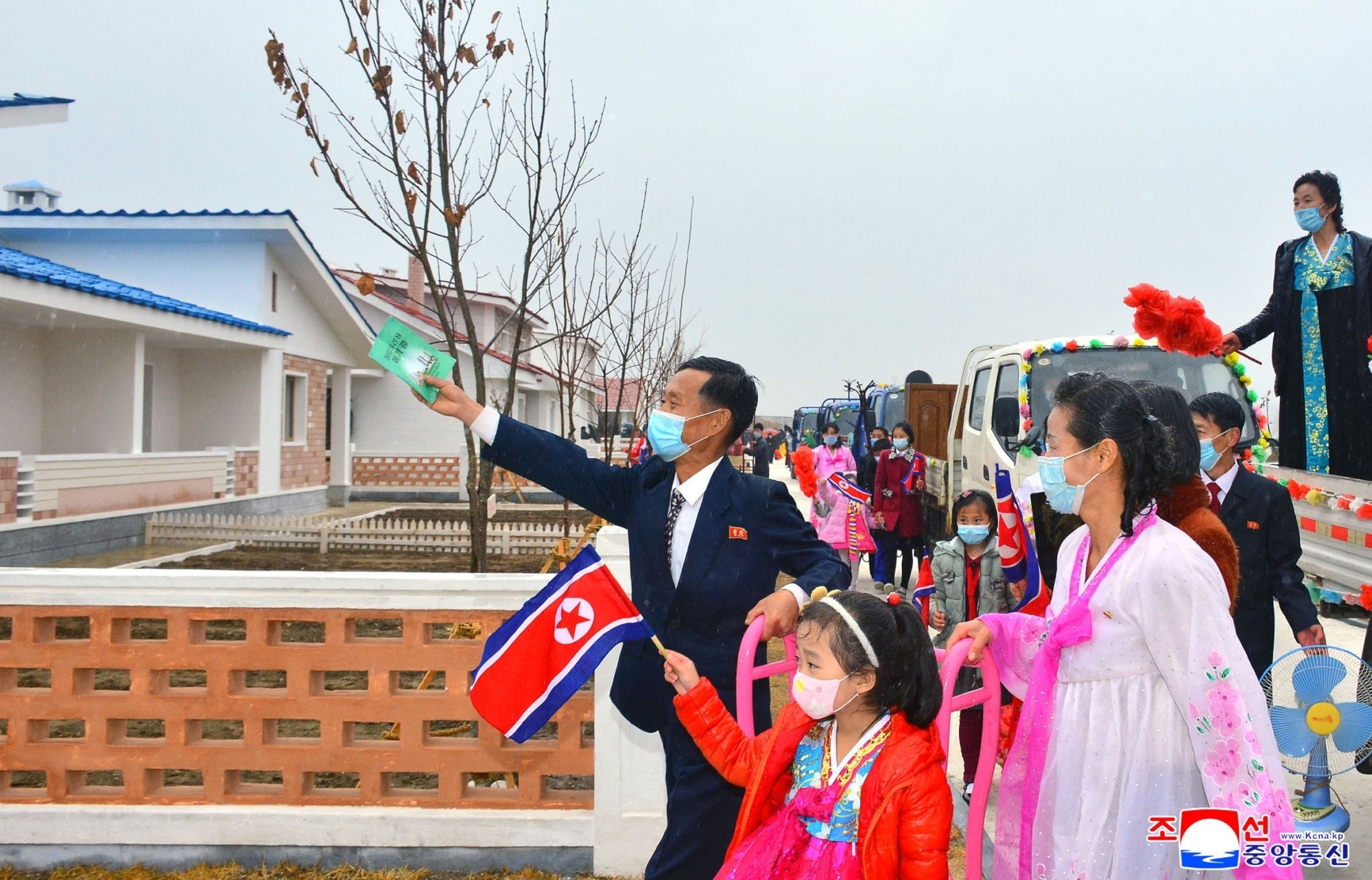 villagers looking around new dwellings