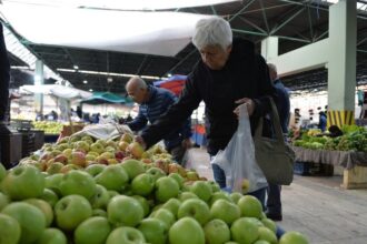 People shop at a market in Ankara