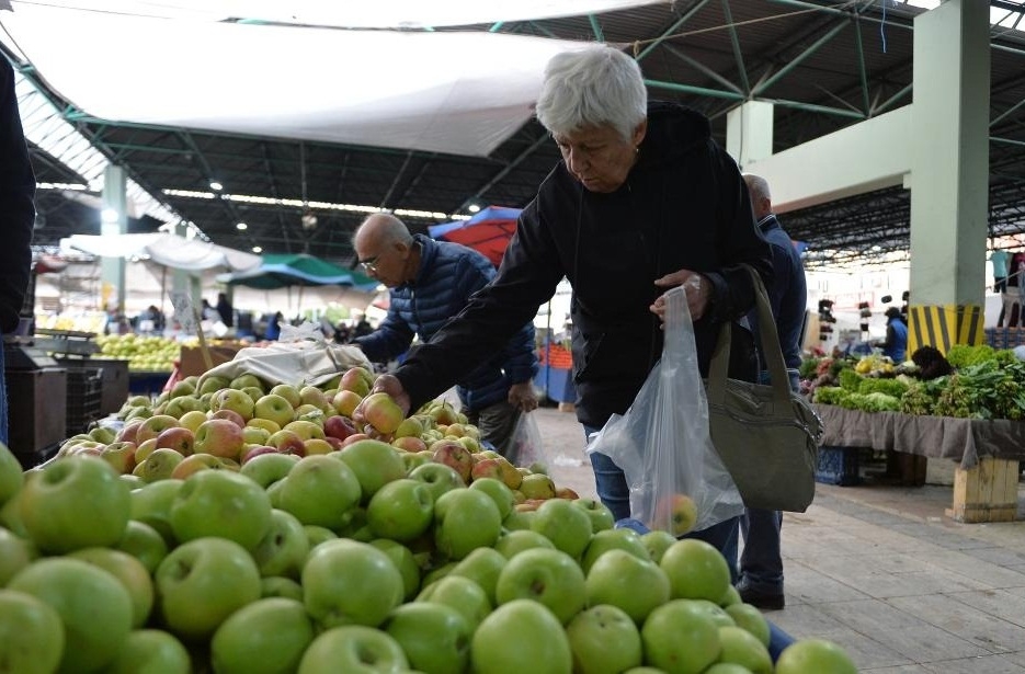 People shop at a market in Ankara