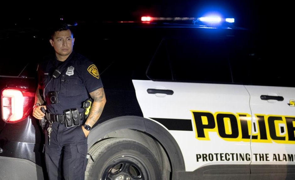 A police officer stands guard around the perimeter