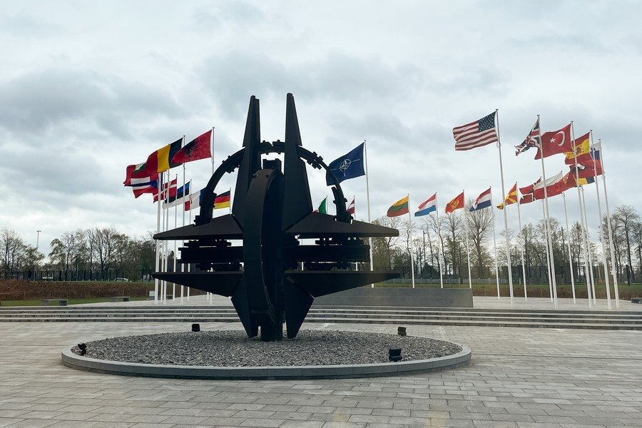 A sculpture and flags at NATO