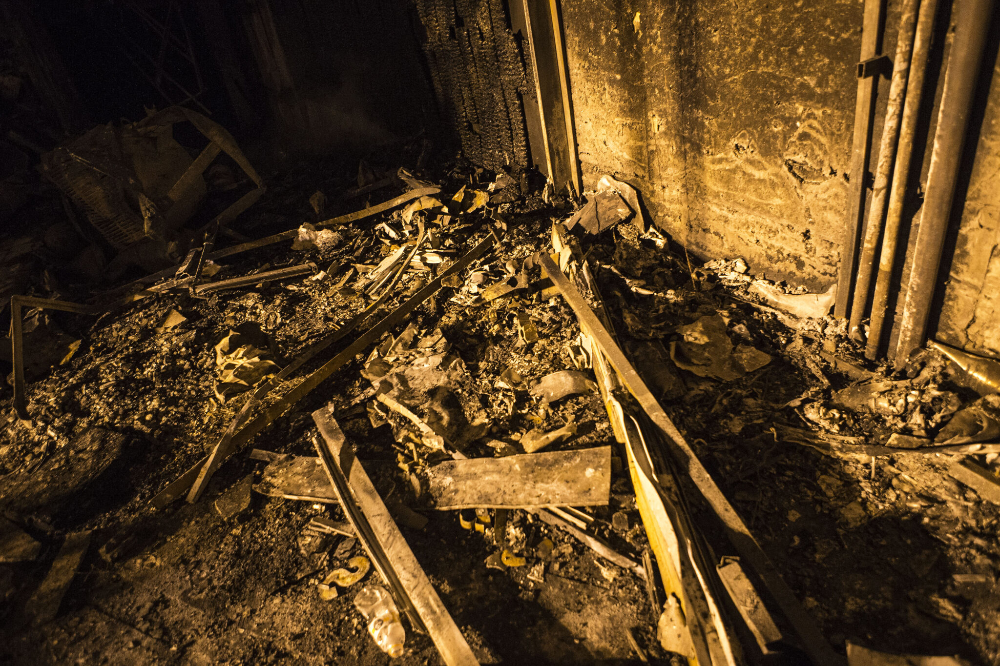 Debris are seen at the explosion site in Tehran