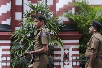 Policemen guard in Colombo