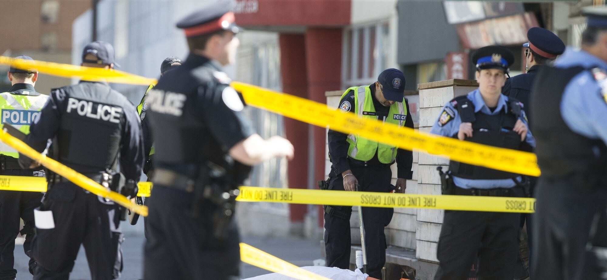 Policemen investigate at the site