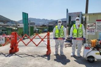 Quarantine officials blocking a road