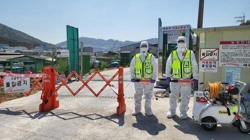 Quarantine officials blocking a road