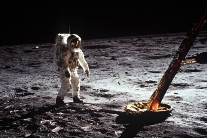 Astronaut 'Buzz' Aldrin walks on the surface of the Moon near a leg of the lunar module during Apollo 11