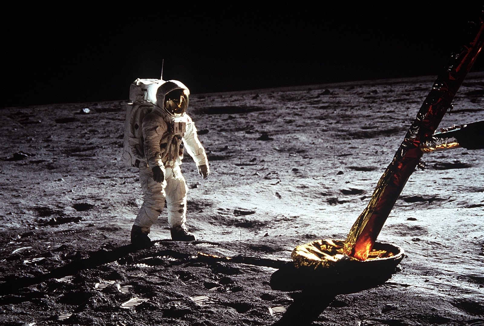 Astronaut 'Buzz' Aldrin walks on the surface of the Moon near a leg of the lunar module during Apollo 11