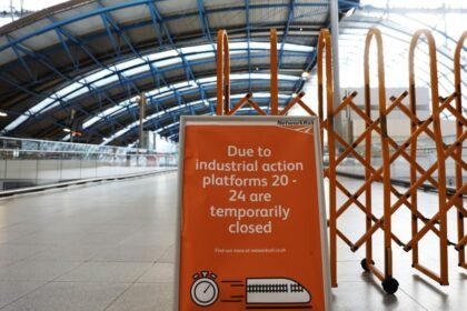 A notice of strike is seen in Waterloo Station in London