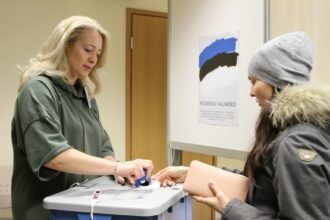 A woman votes at a polling station