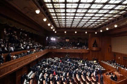 Lawmakers leave after Japanese Prime Minister Shinzo Abe dissolved