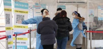 People visit a COVID-19 testing station in downtown Seoul