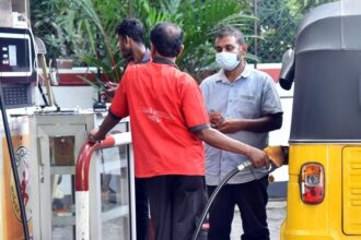 A man fuels a vehicle at a gas station in Colombo