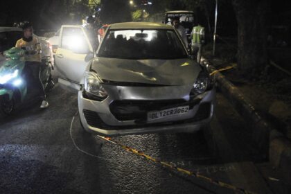 A damaged swift car which hit a cycle rickshaw and dragged it